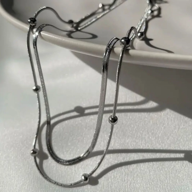 گردنبند دولاین زنجیر توپی و ماری استیل در دورنگ طلایی و نقره ای رنگ ثابت